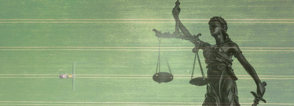 Lady justice blending in on top of an aerial view of a monoculture with a tractor spraying pesticides.